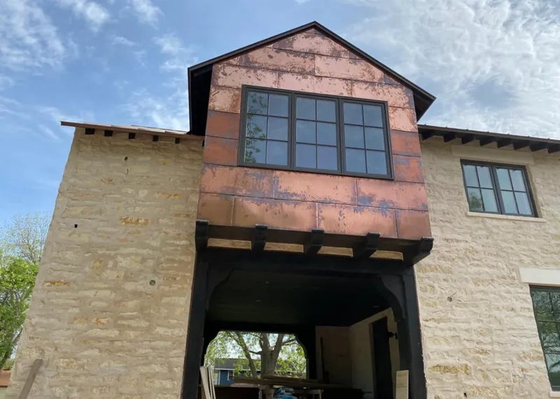 Copper metal panel facade on a stone building for Skylight Installation in Fishkill